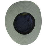 Underside of a navy blue boonie hat with grayish green colored trim with black drawstrings and breathable metal holes towards the crown