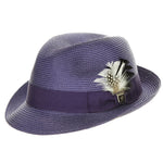 Purple colored fedora hat with thick darker purple band with white and black feather tucked in and a black and silver Stacy Adams pin below it