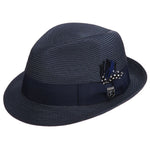 Navy blue colored fedora hat with thick darker navy blue band with blue, white, and black feather tucked in and a black and silver Stacy Adams pin below it