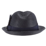 Navy blue colored fedora hat with thick darker navy blue band with blue, white, and black feather tucked in and a black and silver Stacy Adams pin below it