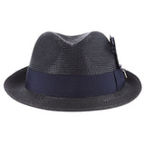Navy blue colored fedora hat with thick darker navy blue band with blue, white, and black feather tucked in and a black and silver Stacy Adams pin below it