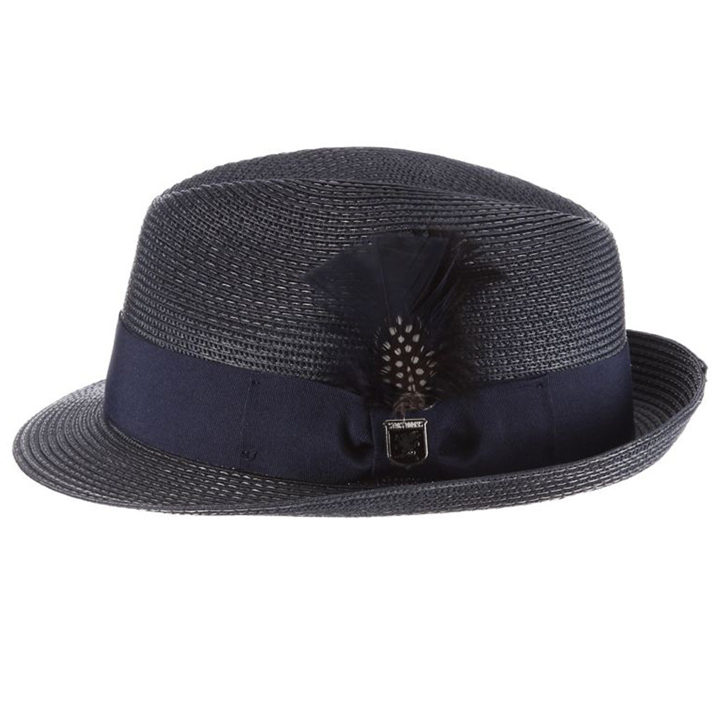 Navy blue colored fedora hat with thick darker navy blue band with blue, white, and black feather tucked in and a black and silver Stacy Adams pin below it