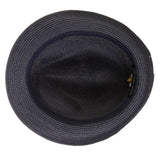 Underside of a navy blue colored fedora hat with thick darker navy blue band with blue, white, and black feather tucked in and a black and silver Stacy Adams pin below it