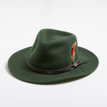 Pine colored fedora hat with a brown band and feather on a white background