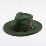 Pine colored fedora hat with a brown band and feather on a white background
