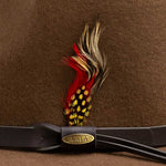 Pecan colored hat with feather and gold Scala logo on a brown band