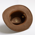 Pecan colored hat with a visible brand label on a white background