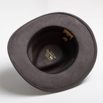 Gray fedora hat with a brand label on a white background