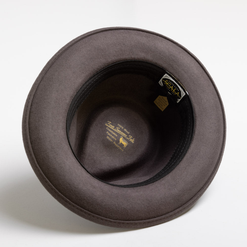 Gray felt hat with a brand label on a white background