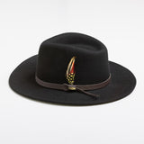 Black fedora hat with a feather on a white background