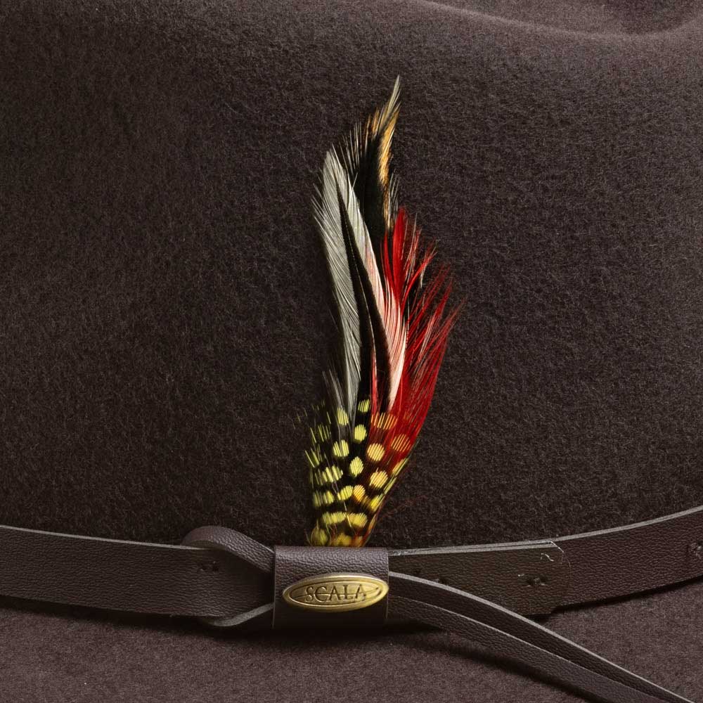 Chocolate colored hat with a decorative feather and leather band featuring a gold Scala brand logo
