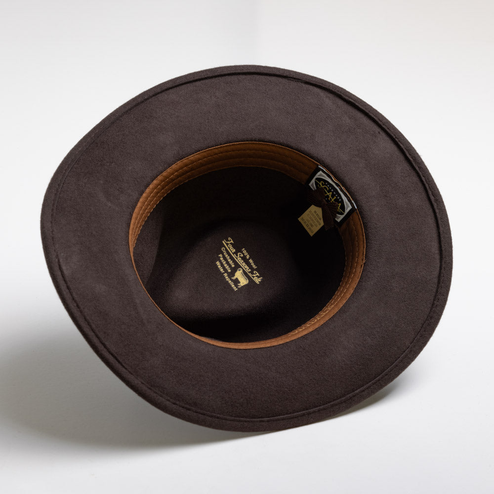 Chocolate colored hat with a visible brand label on a white background