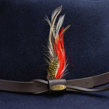 Navy blue feathered hat band with a gold Scala logo on a brown trim