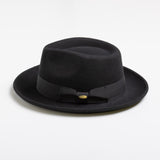 Black fedora hat with a ribbon on a white background