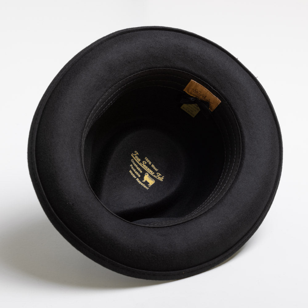 Black hat with a brand label on a white background