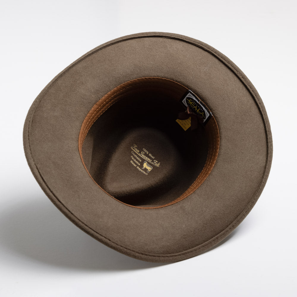 Khaki colored hat with a visible brand label on a white background