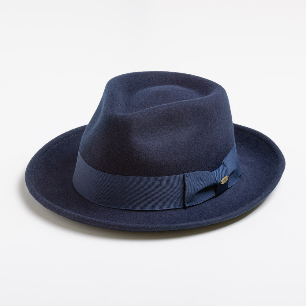 Navy blue fedora hat with a ribbon on a light gray background