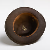 Chocolate brown hat with visible branding on a white background