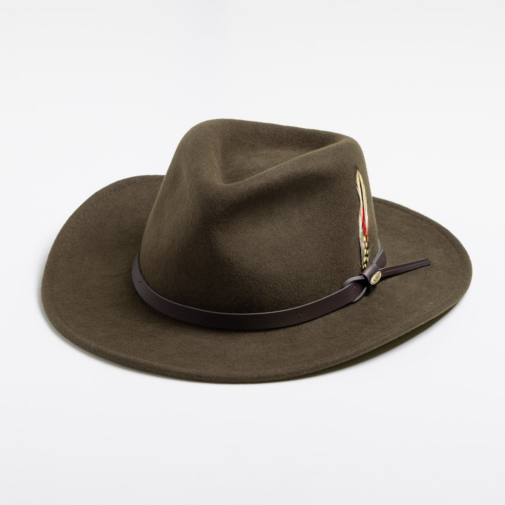 Olive colored  fedora hat with a brown band and feather on a white background