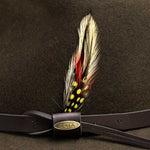 Olive colored hat with a feather and gold Scala logo on brown band
