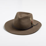 Khaki colored fedora hat with a feather on a white background